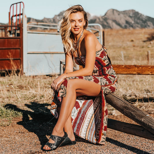 FREEBIRD women's Asher black sandal with adjustable belt buckles, a suede footbed and silver embellishments lifestyle image