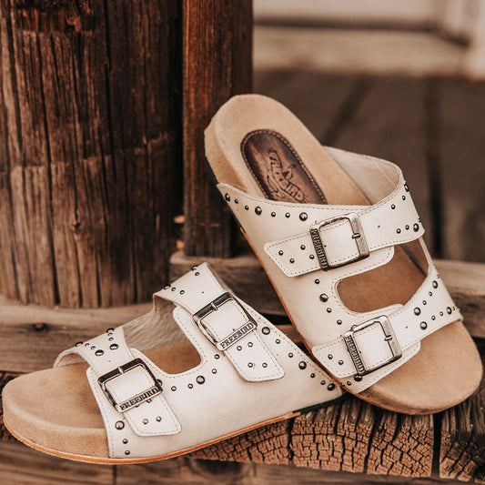 FREEBIRD women's Asher bone sandal with adjustable belt buckles, a suede footbed and silver embellishments