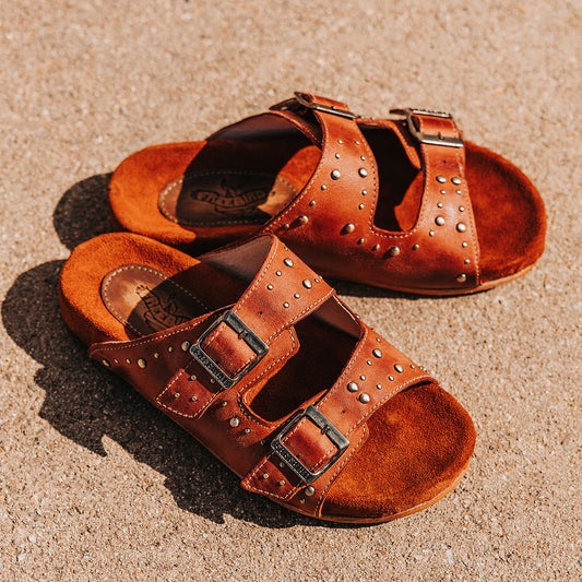 FREEBIRD women's Asher rust sandal with adjustable belt buckles, a suede footbed and silver embellishments