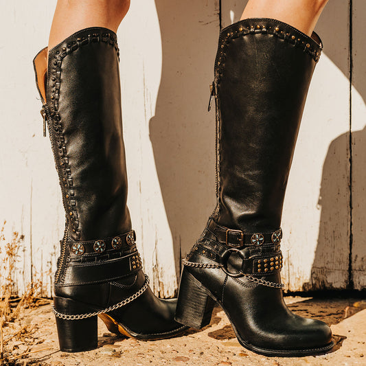 FREEBIRD women's Blakely black heeled tall boot with shaft detailing, layered decretive ankle harnesses, and back zip closure