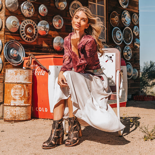 FREEBIRD women's Brooke black leather sandal with an adjustable leather ankle strap, flame leather overlays and an open toe silhouette lifestyle