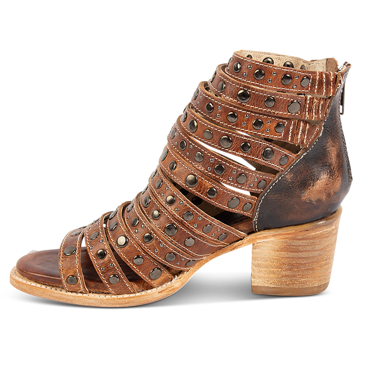 Inside view showing a stacked heel and embellished leather straps on FREEBIRD women's Cannes cognac leather sandal