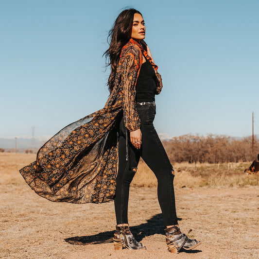 FREEBIRD women's Carterr ice multi sandal with back lacing and a front dip lifestyle image