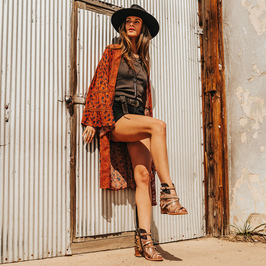 FREEBIRD women's Carterr taupe sandal with back lacing and a front dip lifestyle image