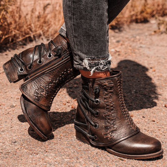 FREEBIRD women's Cedrick black distressed leather bootie with a leather shaft overlay, back leather lacing and round toe construction