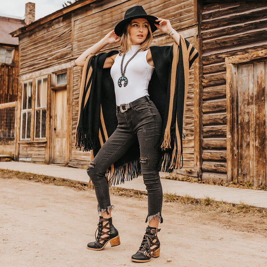 FREEBIRD women's Cheyenne black multi laser cut criss-cross leather lace up front silver buckle detail ankle bootie lifestyle image