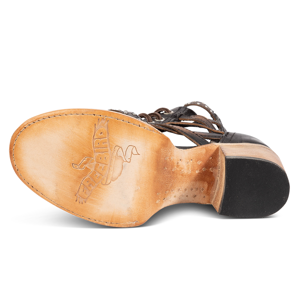 Leather sole imprinted with FREEBIRD on women's Cheyenne black multi bootie