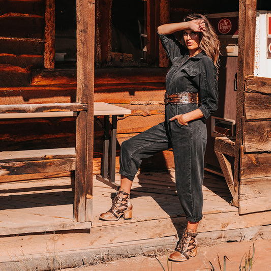 FREEBIRD women's Cheyenne taupe multi laser cut criss-cross leather lace up front silver buckle detail ankle bootie lifestyle image