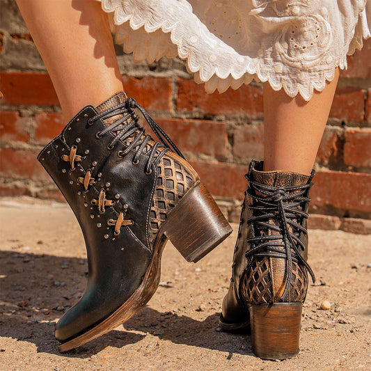 FREEBIRD women's Columbia black two-toned leather bootie with laser cut back panel detailing, adjustable back leather lacing and lifted heel