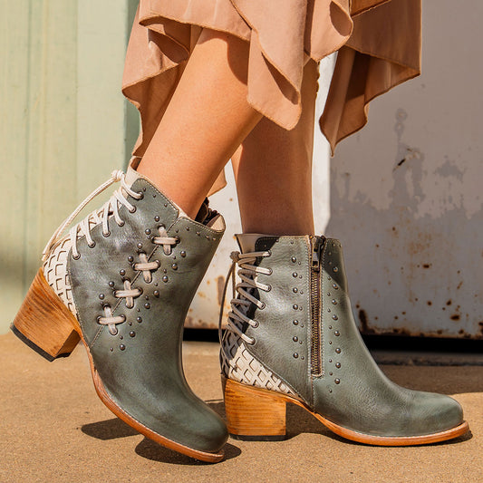FREEBIRD women's Columbia blue two-toned leather bootie with laser cut back panel detailing, adjustable back leather lacing and lifted heel