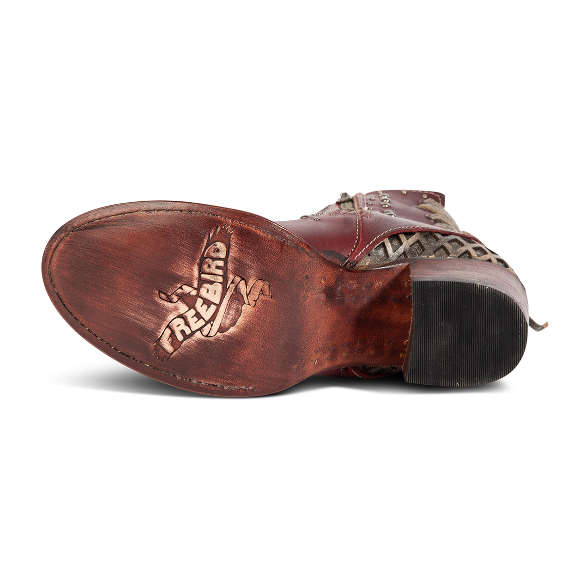 Leather sole imprinted with FREEBIRD on women's Columbia red leather bootie