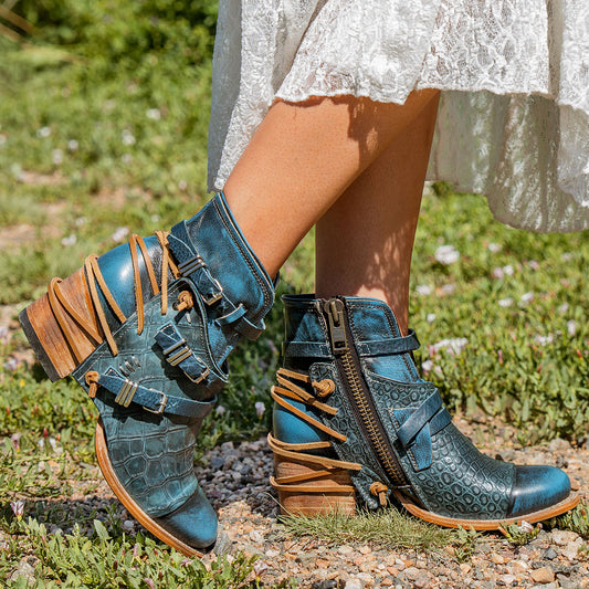 CRUE Blue Multi leather back lace booties with two-texture leather, decorative buckled straps, and side zippers.