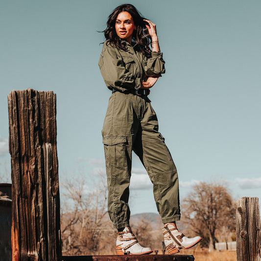 FREEBIRD women's Crue ice leather cutout ankle bootie with silver hardware straps and back lacing detail lifestyle image