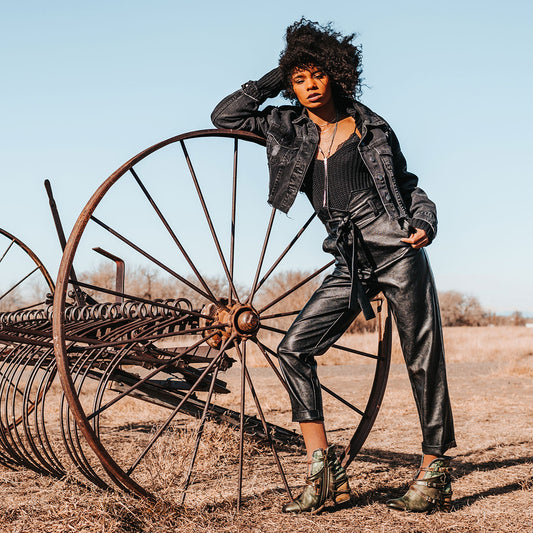 FREEBIRD women's Crue olive multi leather cutout ankle bootie with silver hardware straps and back lacing detail lifestyle image