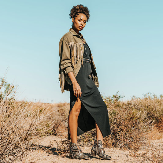 FREEBIRD women's Crue olive multi leather cutout ankle bootie with silver hardware straps and back lacing detail lifestyle image