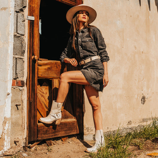 FREEBIRD women's Darcy beige leather boot with a studded ankle harness, leather pull straps, an inside zip closure and a square toe