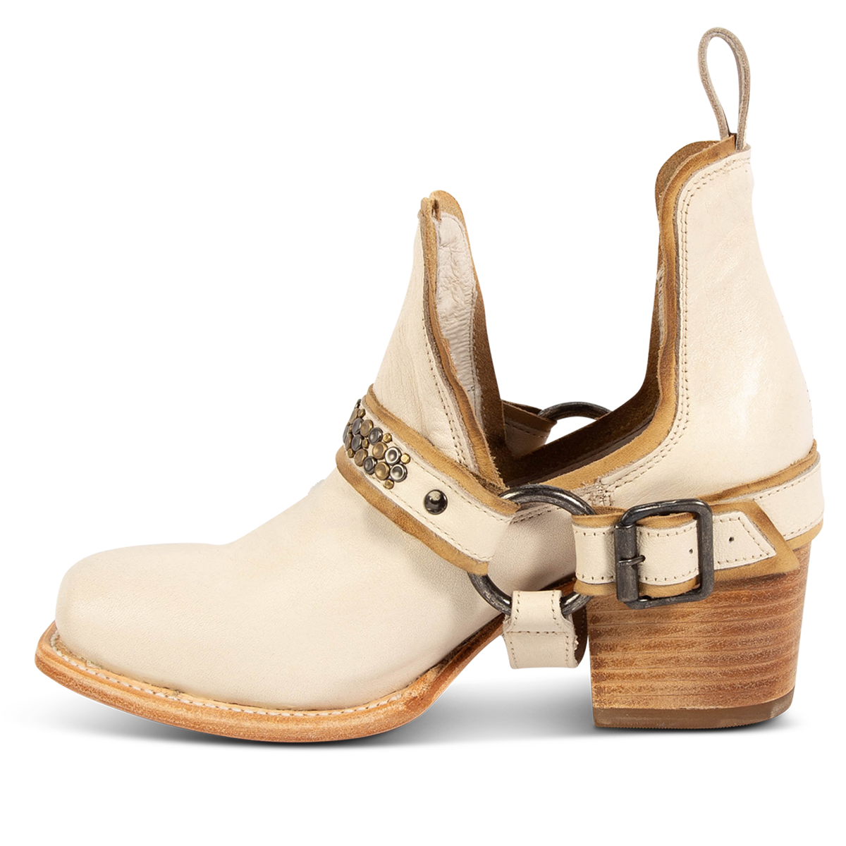 Inside view showing FREEBIRD women's Dusty off white bootie with studded embellishments, an ankle harness and a slip on leather pull strap