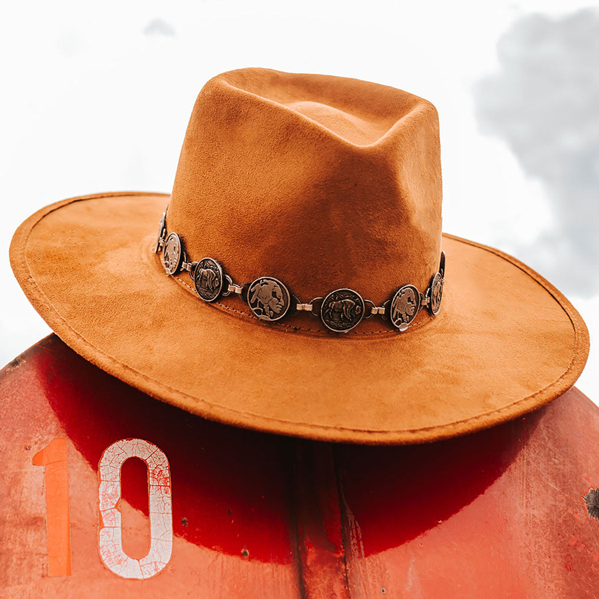 FREEBIRD Gemini rust wide flat-brim hat featuring diamond-shaped crown and metal coin band