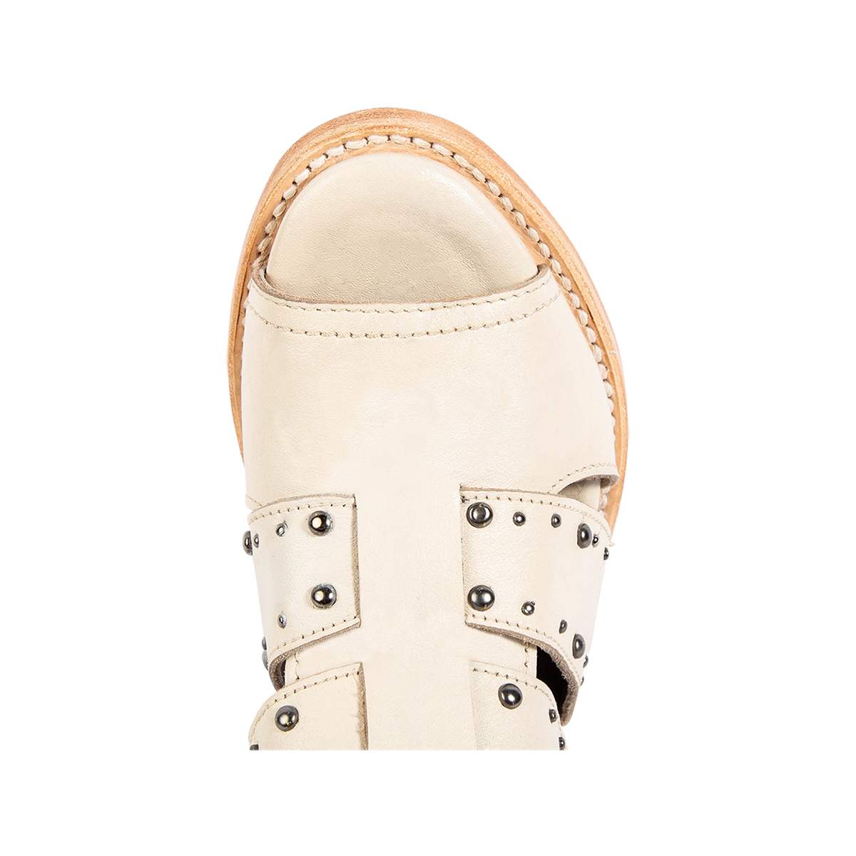 Top view showing a rounded toe and metal embellishments on FREEBIRD women's Ghost off white leather sandal