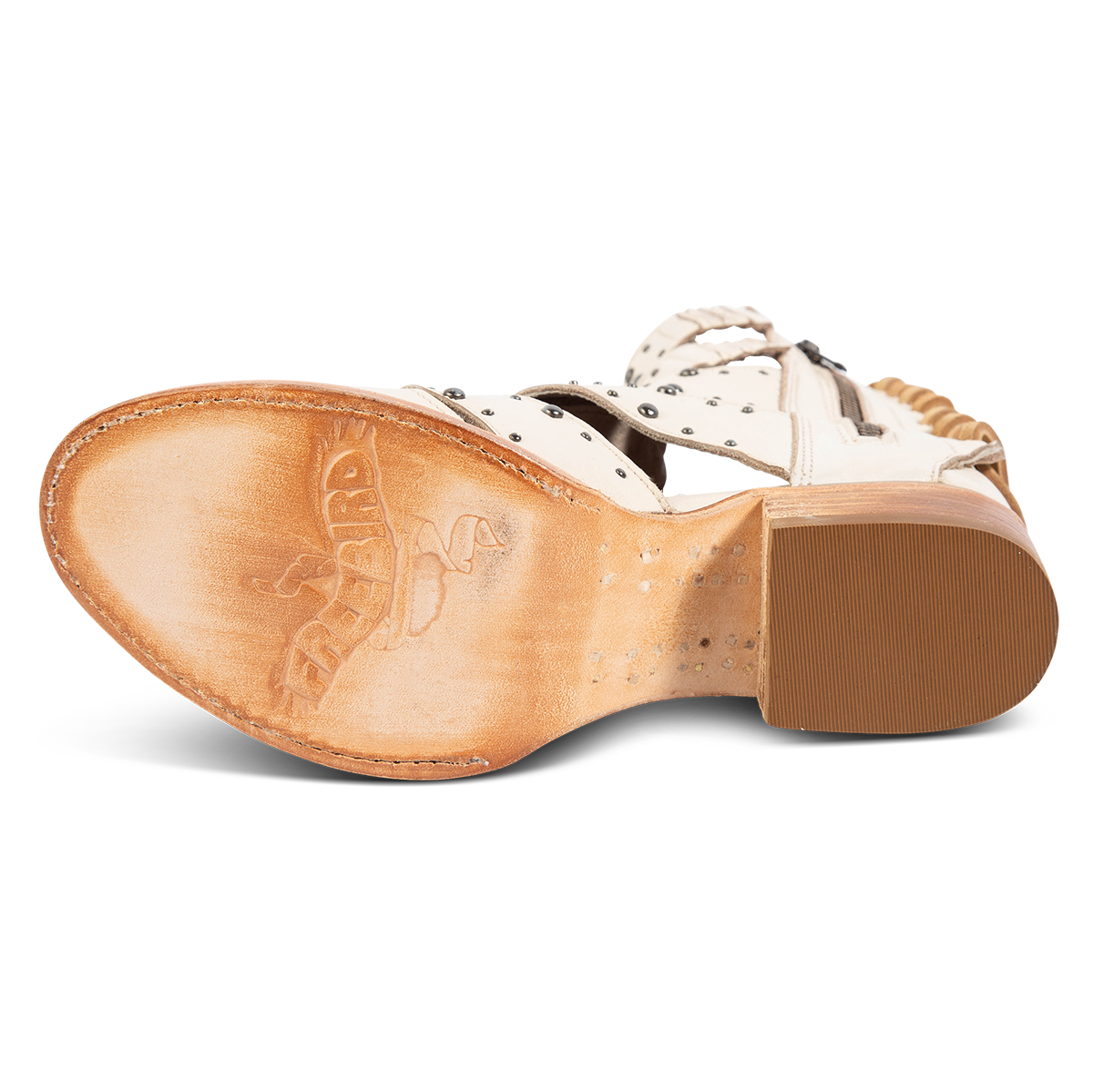 Leather sole imprinted with FREEBIRD on women's Ghost off white leather sandal