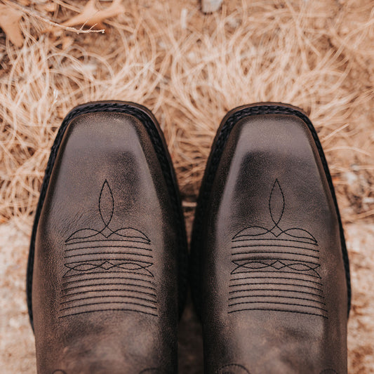 FREEBIRD men's James black boot with traditional Western stitching, tread sole and leather pull straps