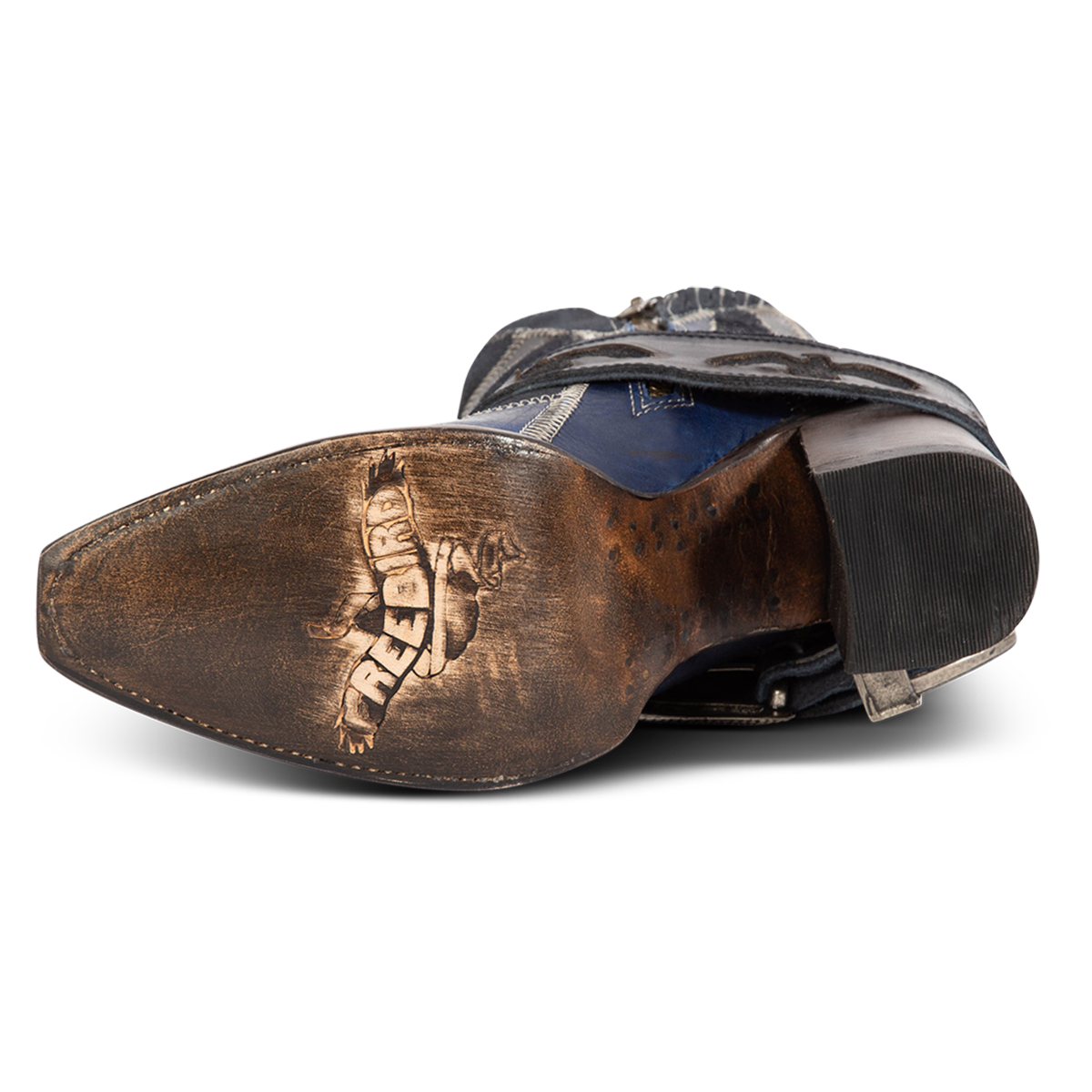 Leather sole imprinted with FREEBIRD on women's JAYMIE navy multi patchwork leather bootie