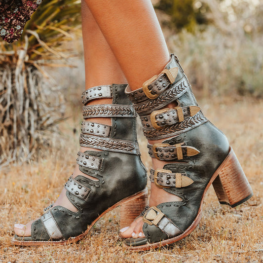 FREEBIRD women's Jett blue leather sandal with adjustable gold buckling, a high lifted heel and metallic chevron stitching