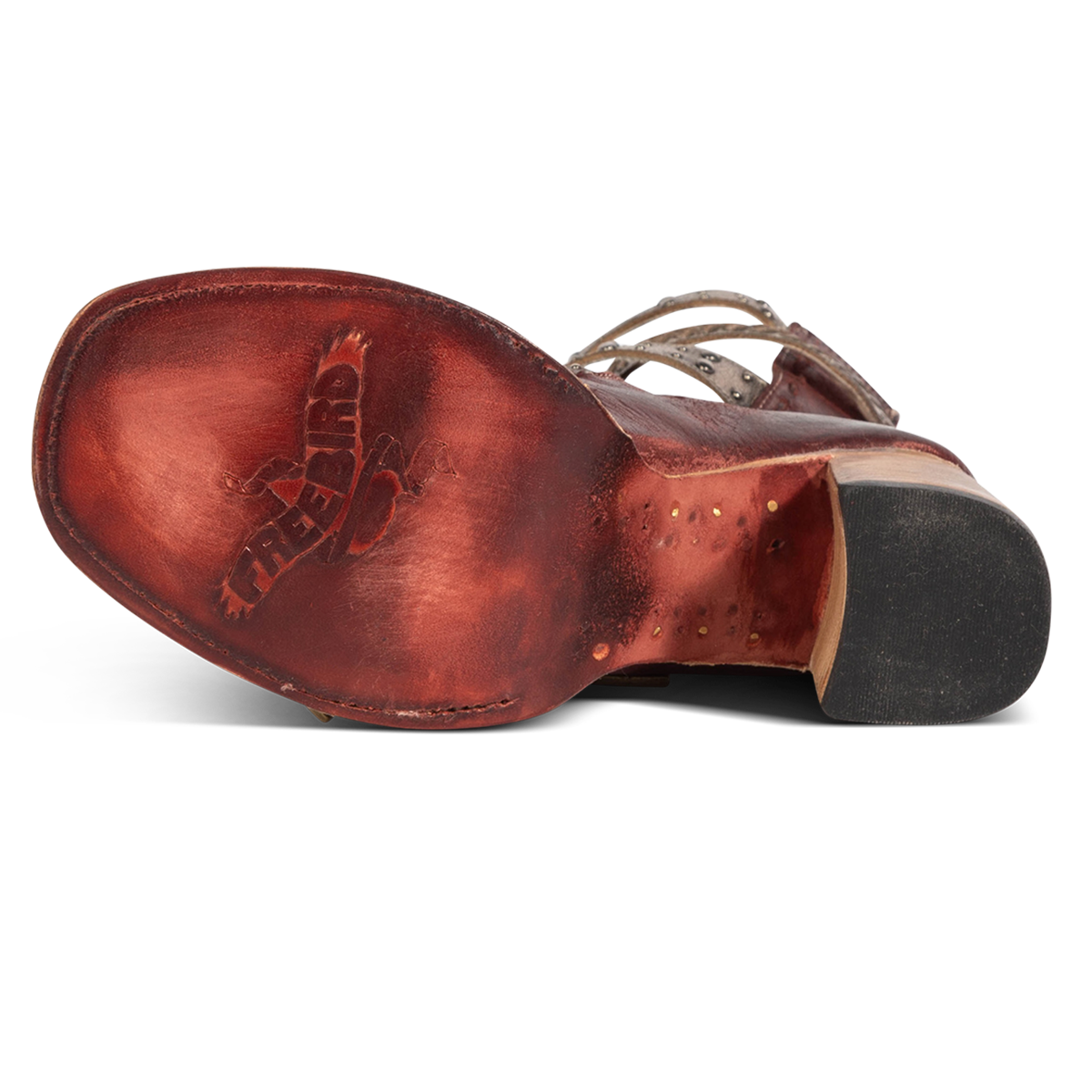 Leather sole imprinted with FREEBIRD on women's Jett red leather sandal