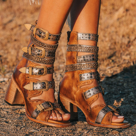 FREEBIRD women's Jett wheat leather sandal with adjustable gold buckling, a high lifted heel and metallic chevron stitching
