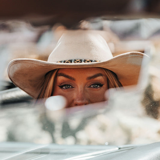 FREEBIRD Jones beige western cowboy hat featuring teardrop crown, upturned-brim, and braided leather band lifestyle