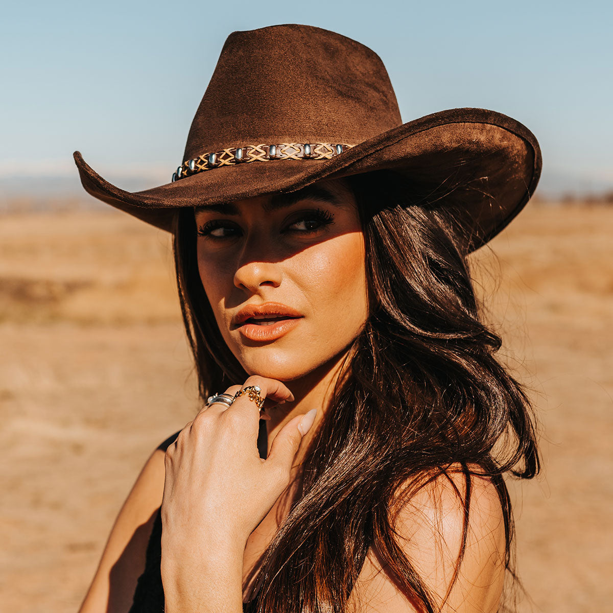 FREEBIRD Jones beige western cowboy hat featuring teardrop crown, upturned-brim, and braided leather band