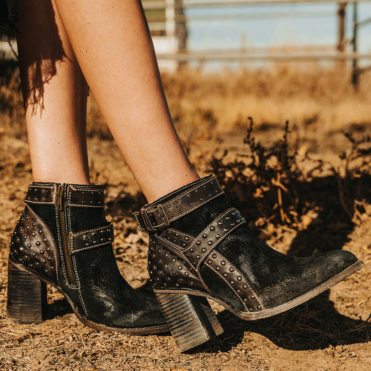 FREEBIRD women's Jovi black suede bootie with inside zip closure, flare heel, and stud detailing