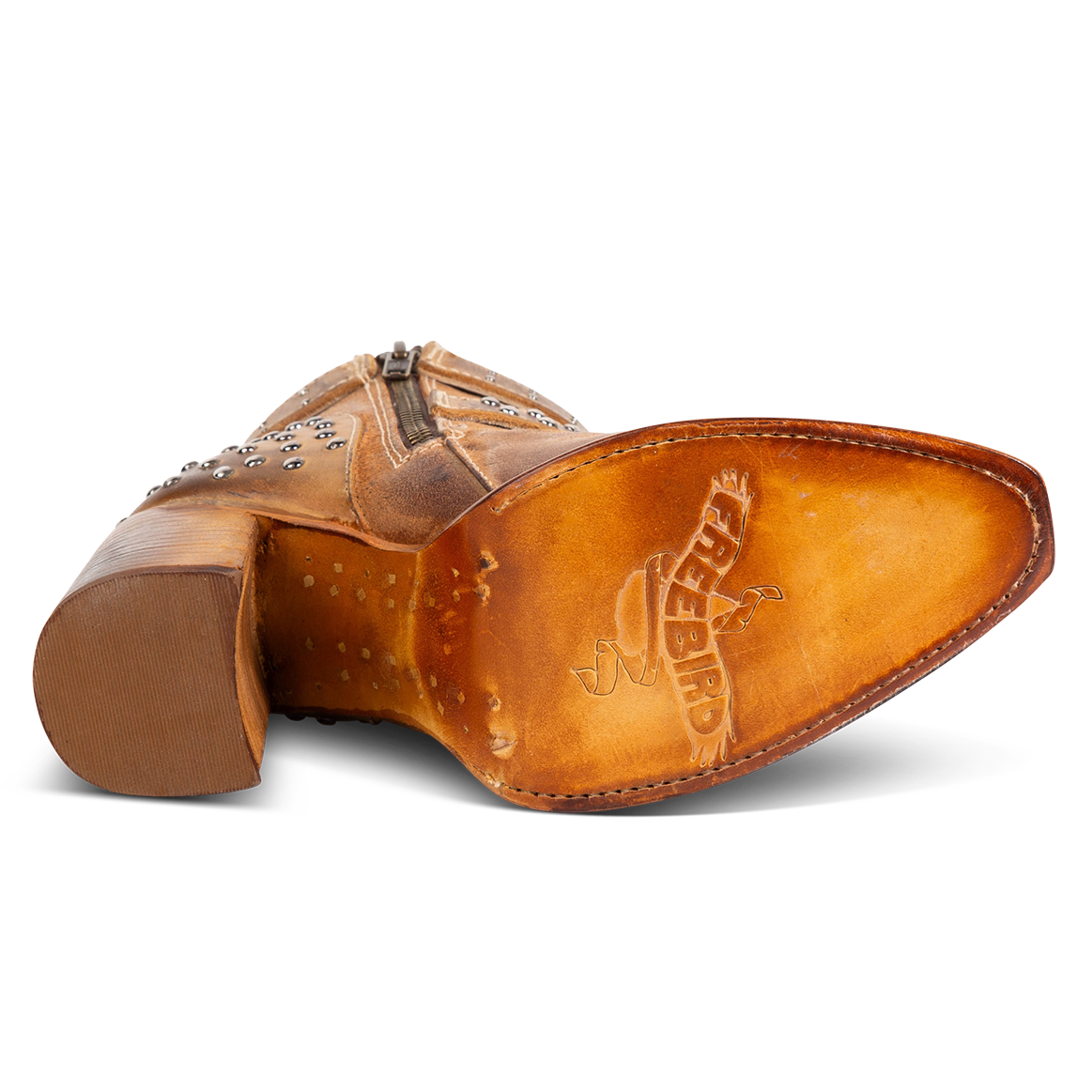 Tan leather sole imprinted with FREEBIRD on women's Jovi cognac suede bootie