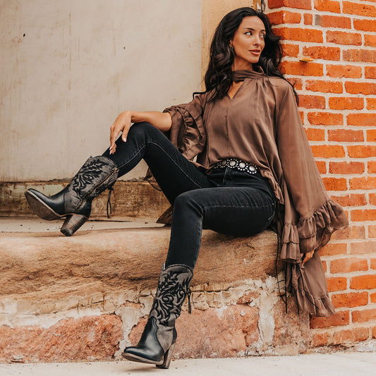 FREEBIRD women's Magnolia black denim and leather boot with mono shaft stitching, back panel lacing and a curved pointed toe silhouette lifestyle