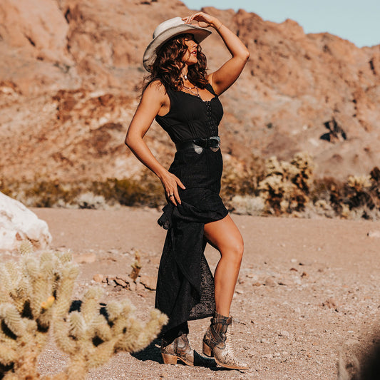 FREEBIRD women's Morgan black white python leather ankle bootie with silver stud embellishments, gore detailing, and buckle straps lifestyle image