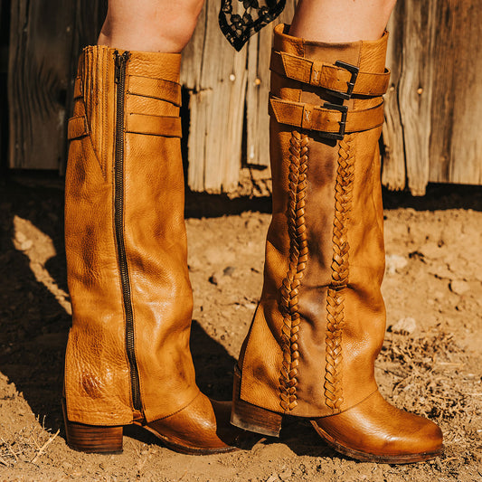 FREEBIRD women's Nighthawk wheat tall boot with braided inlay detailing, brass zip closure, and round toe