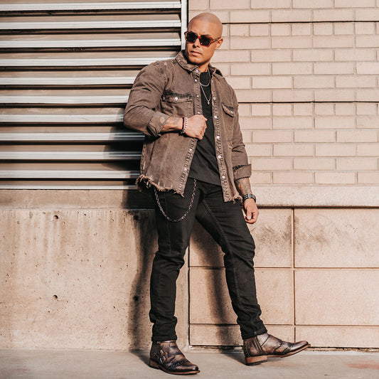 FREEBIRD men's Penn black dress boot with brogue detailing and decorative straps lifestyle image