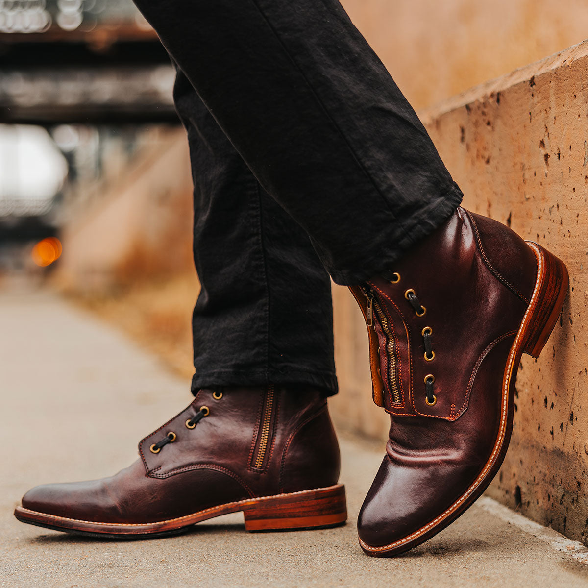 FREEBIRD men's Porter wine leather boot featuring double zip closures, adjustable front lacing and an almond toe
