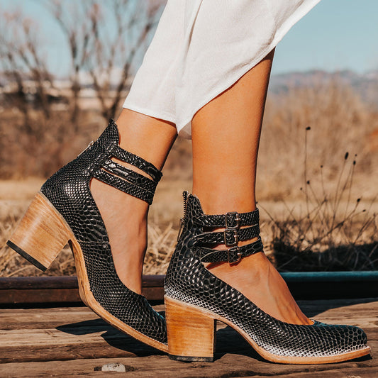 FREEBIRD women's Randi black snake embossed leather open construction ankle strap heel with adjustable rustic buckles