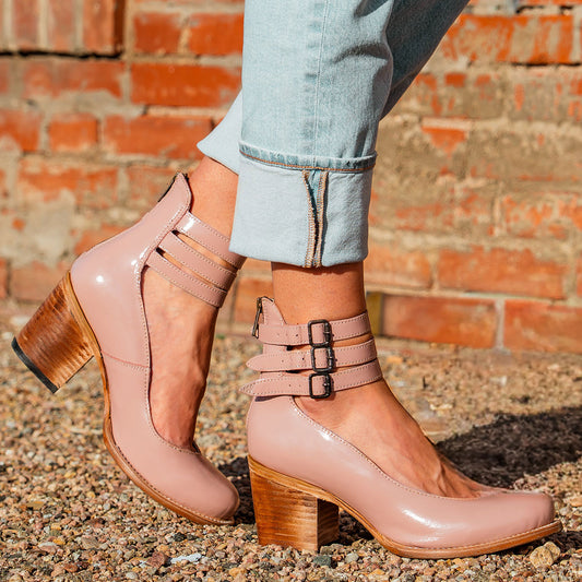 Freebird women's RANDI blush patent leather ankle strap heels with a round toe, three adjustable metal buckles, and a back zipper.