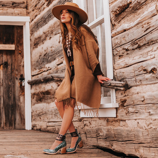 FREEBIRD women's Randi turquoise croco embossed leather open construction ankle strap heel with adjustable rustic buckles lifestyle image