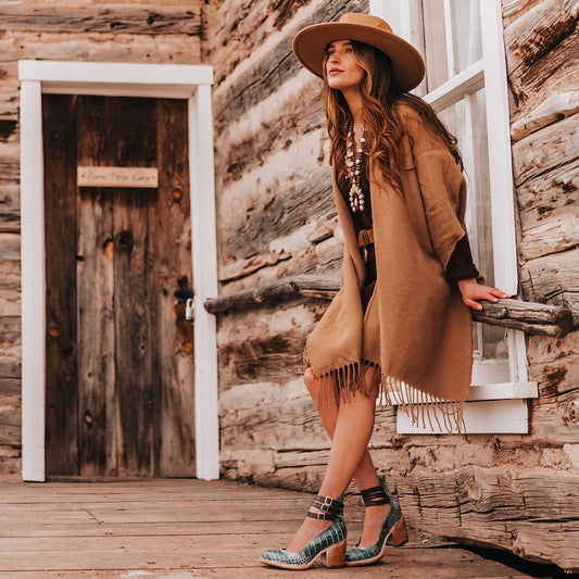 FREEBIRD women's Randi turquoise croco embossed leather open construction ankle strap heel with adjustable rustic buckles lifestyle image