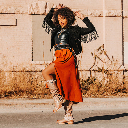 FREEBIRD women's Roadey taupe tall construction boot with double buckle detailing and signature red tracked zipper lifestyle image