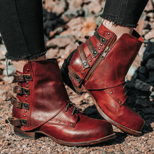 Red multi-colored RYNN leather booties featuring an abstract overlay design and a western-style stacked heel.