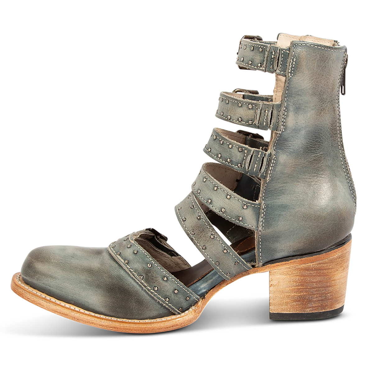 Inside view showing a stacked heel, adjustable leather straps and embellishments on FREEBIRD women's Salty blue leather bootie