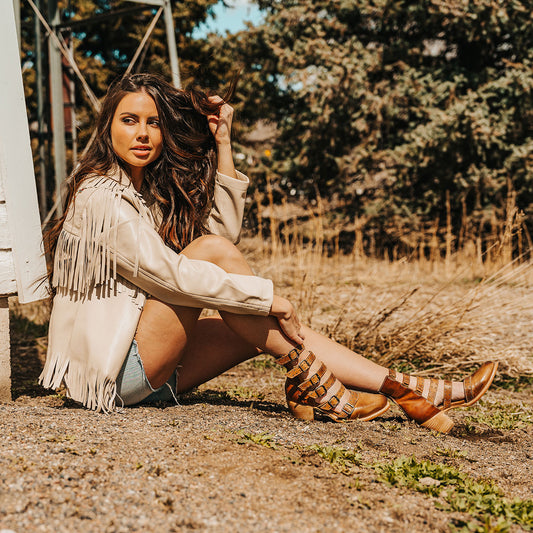 FREEBIRD women's Salty wheat leather bootie with adjustable leather straps, a low block heel and an almond toe lifestyle