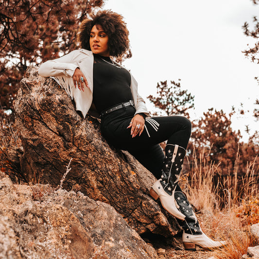 FREEBIRD women's Starzz black leather cowboy boot with two-toned leather star inlay detailing traditional stitching and snip toe construction lifestyle image