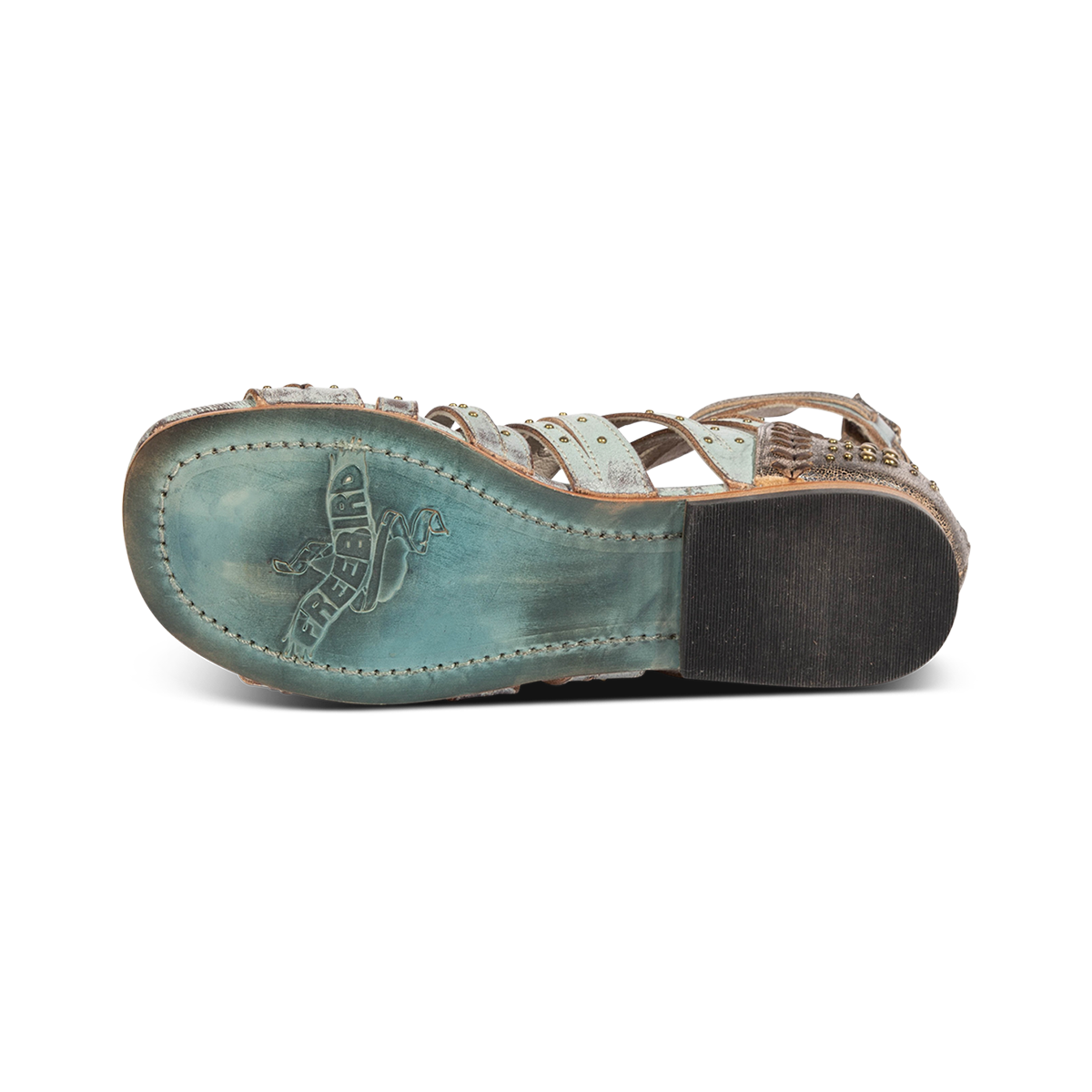 Leather sole imprinted with FREEBIRD on women's Swan blue leather sandal