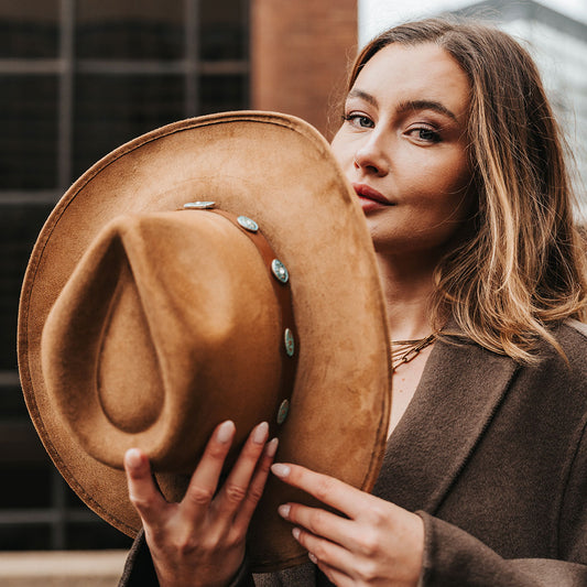 FREEBIRD Wesson camel distressed cowboy hat featuring teardrop crown, western curved brim, and turquoise metal detailing