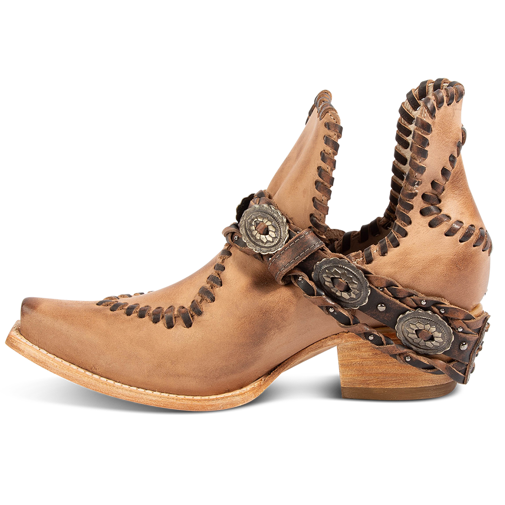Inside view FREEBIRD women's Whimsical natural leather bootie with a low heel, braided belt and whip stitch detailing